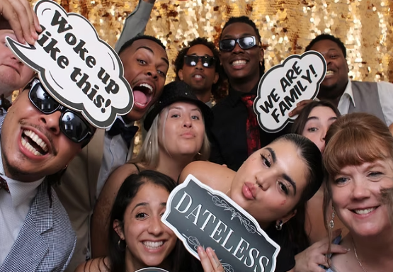 people clicking photos with photobooth and enjoying their times 