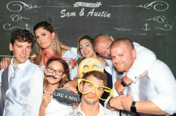 couples taking pictures at a Wedding Photobooth Rental  