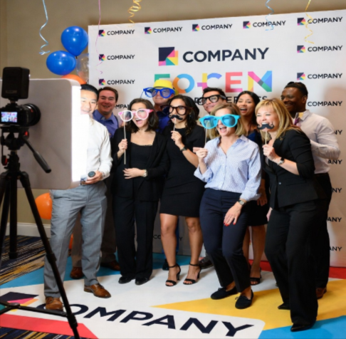 people gathered around the booth at corporate event.